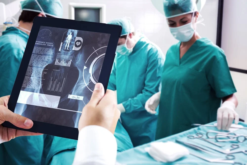 Man20using20tablet20pc20against20medical20interface20on20xray-1